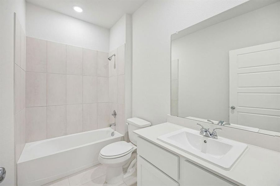 Bathroom in the Stanley II home plan by Trophy Signature Homes – REPRESENTATIVE PHOTO