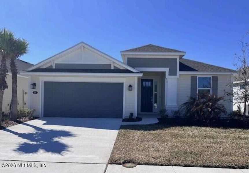 Front exterior of a new home in Colbert Landings, Palm Coast, FL, highlighting curb appeal (Image 1). Front exterior of a new home in Colbert Landings, Palm Coast, FL, highlighting curb appeal (Image 1).