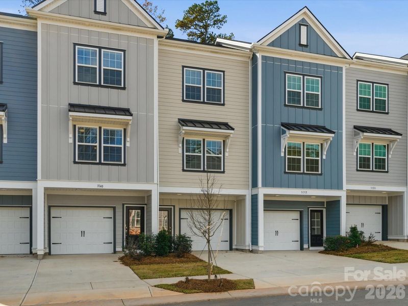 Front exterior of a new home in Sycamore Trail, Matthews, NC, highlighting curb appeal (Image 28).