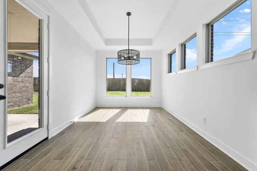 Spacious, unfurnished interior of a new home in Meridiana, Manvel (Image 13).