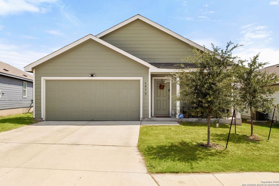 Front exterior of a new home in Vista Point, San Antonio, TX, highlighting curb appeal (Image 18). Front exterior of a new home in Vista Point, San Antonio, TX, highlighting curb appeal (Image 18).