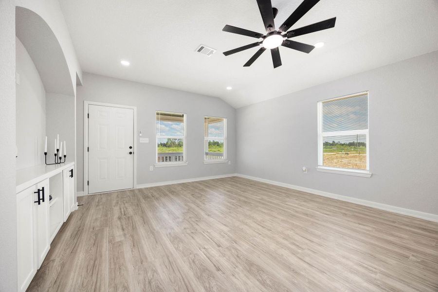 This expansive living area is flooded with brilliant natural light, pouring in through the windows to create a bright, airy, and welcoming atmosphere This expansive living area is flooded with brilliant natural light, pouring in through the windows to create a bright, airy, and welcoming atmosphere