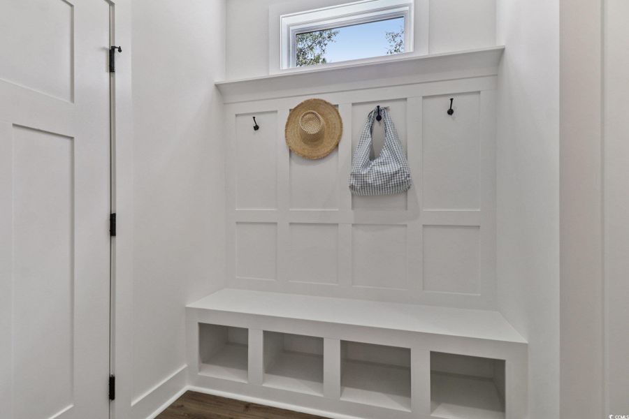 Mudroom featuring dark wood-style flooring