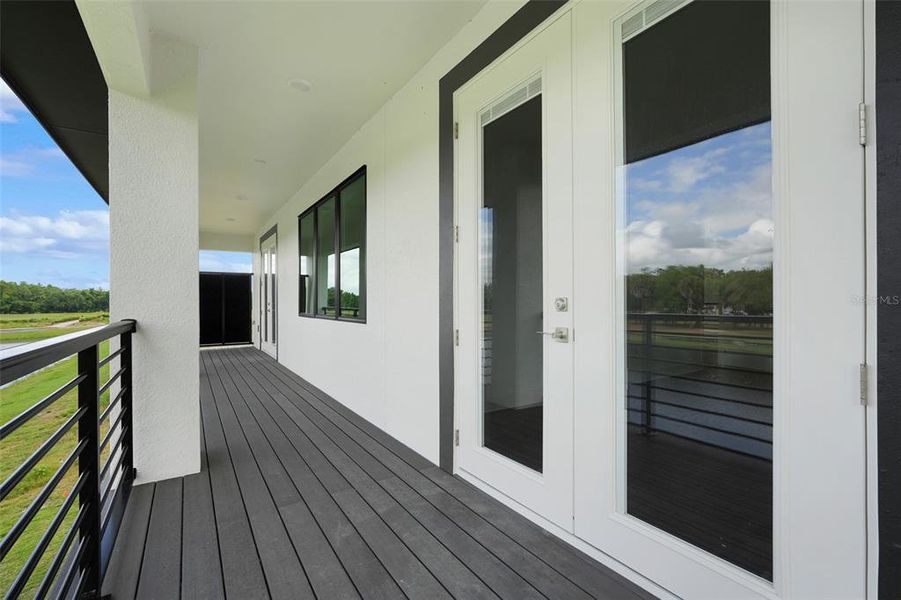 Exterior details and patio area of a home in Hampton Green at Providence, Davenport (Image 4).