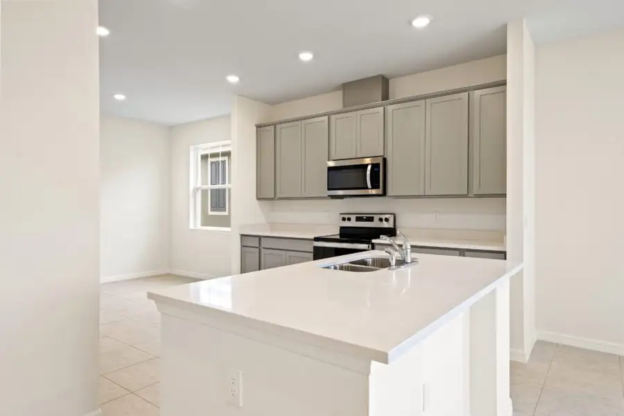 Representative furnished interior of a home built from the Biscayne by Holiday Builders in Eden Hills, Lake Alfred (Image 4).