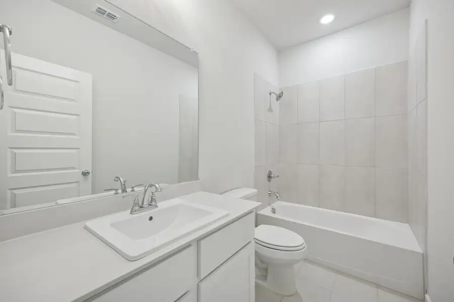 Bathroom in the Masters home plan by Trophy Signature Homes – REPRESENTATIVE PHOTO