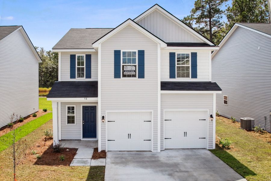 Representative exterior photo of a completed home built from the The Dunham by RTS Homes in Grand Reserve, Hinesville, GA (Image 17). Representative exterior photo of a completed home built from the The Dunham by RTS Homes in Grand Reserve, Hinesville, GA (Image 17).