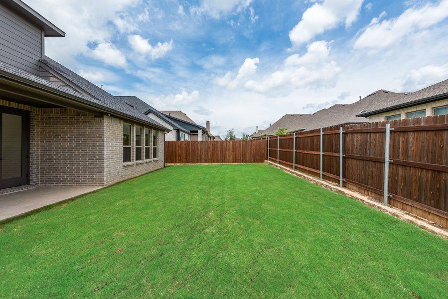 Exterior details and patio area of a home in Tavolo Park, Fort Worth (Image 3).