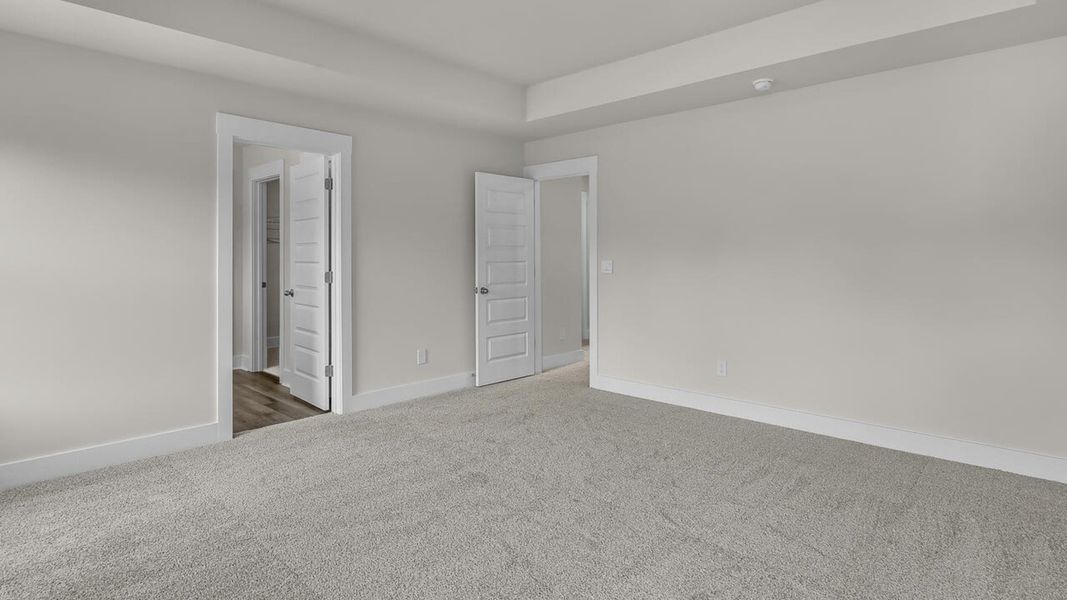 Spacious, unfurnished interior of a new home in The Haven at Indigo Preserve, Leland (Image 28).