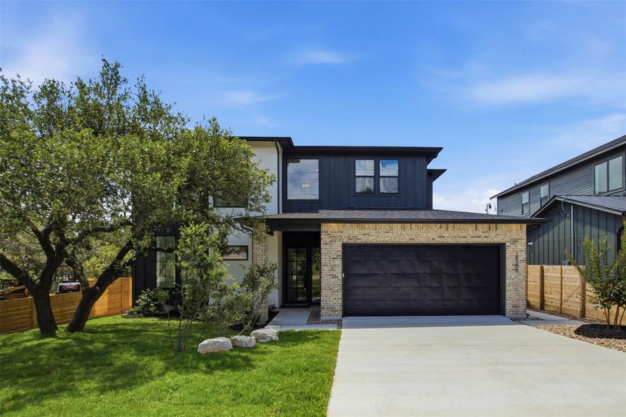 Front exterior of a new home in , Jonestown, TX, highlighting curb appeal (Image 23). Front exterior of a new home in , Jonestown, TX, highlighting curb appeal (Image 23).