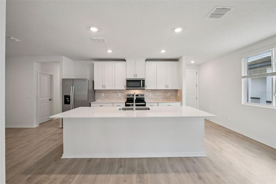 Furnished interior view inside a new home in Ridgehaven - Villas, Ormond Beach (Image 4).