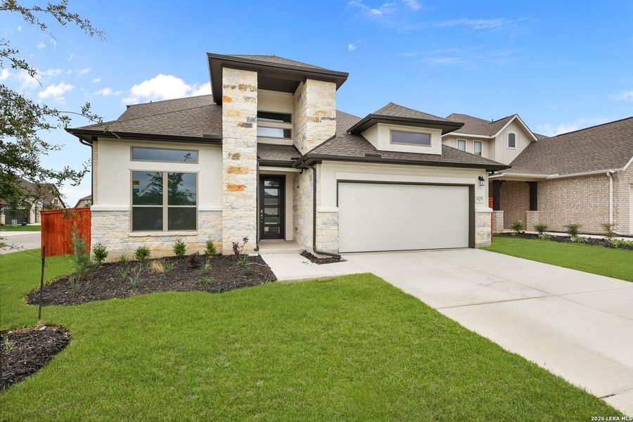 Front exterior of a new home in Megan's Landing, Castroville, TX, highlighting curb appeal (Image 28).