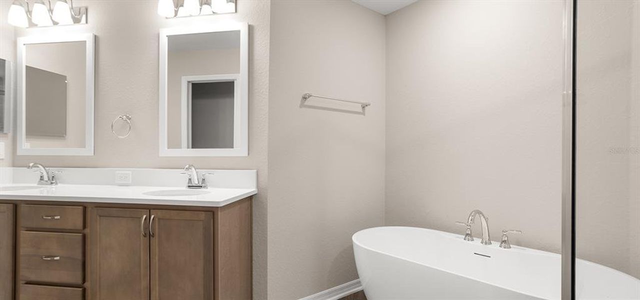 Furnished interior view inside a new home in Estates at Hickory Cove - Bungalows, St. Cloud (Image 5).