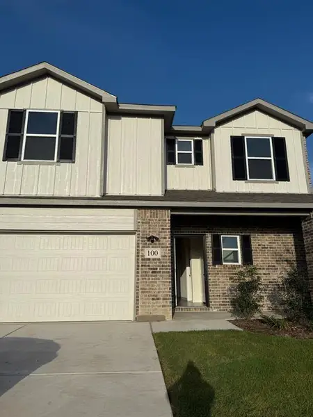 View of front of house featuring an attached garage, brick siding, concrete driveway, and a front yard View of front of house featuring an attached garage, brick siding, concrete driveway, and a front yard