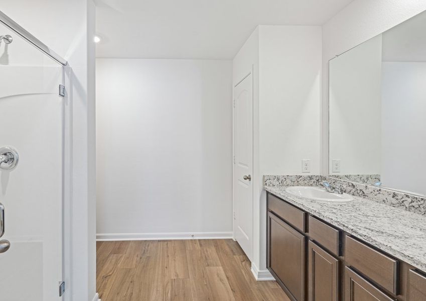 Master bathroom with a walk-in shower and double-sink vanity. Master bathroom with a walk-in shower and double-sink vanity.