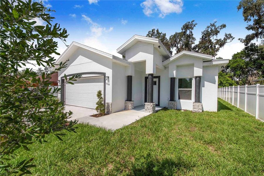 Front exterior of a new home in , Haines City, FL, highlighting curb appeal (Image 18).