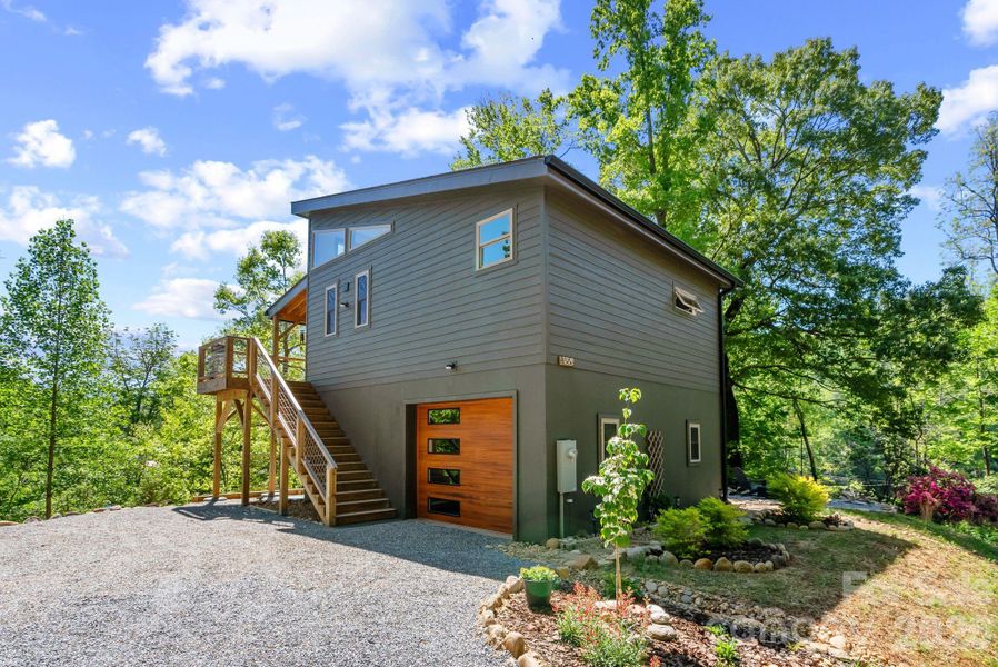 Perched on a perfect peninsula of land at the top of a knoll on a quiet road.