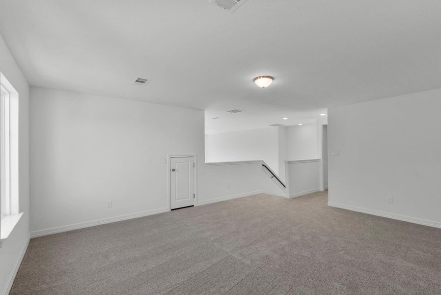 Vast and versatile game room, perfect for entertainment, gatherings, and endless fun for the whole family.