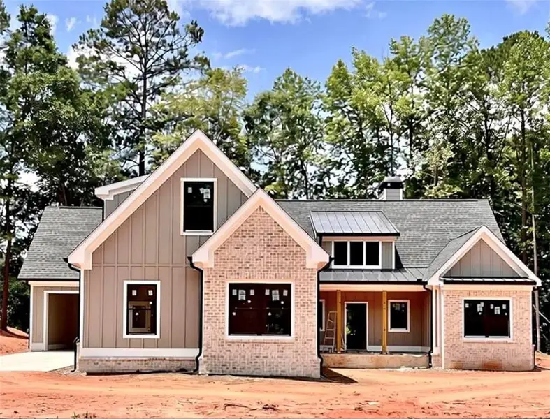 Front exterior of a new home in , Covington, GA, highlighting curb appeal (Image 1). Front exterior of a new home in , Covington, GA, highlighting curb appeal (Image 1).