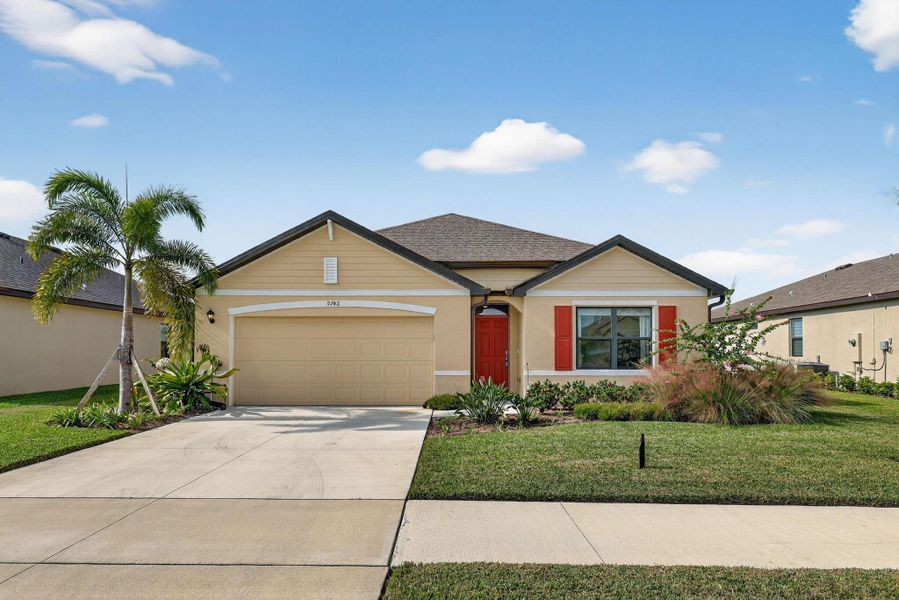 Front exterior of a new home in , Port St. Lucie, FL, highlighting curb appeal (Image 2). Front exterior of a new home in , Port St. Lucie, FL, highlighting curb appeal (Image 2).