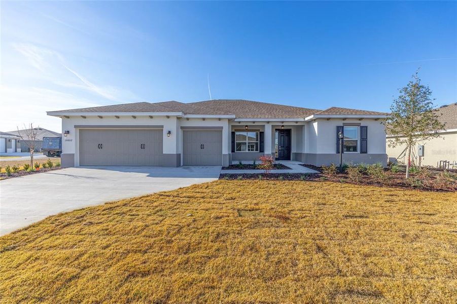 Front exterior of a new home in , Ocala, FL, highlighting curb appeal (Image 17).