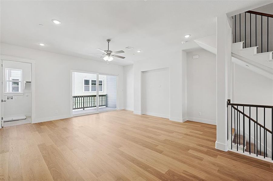 Unfurnished living room featuring recessed lighting, light wood-type flooring, and a ceiling fan