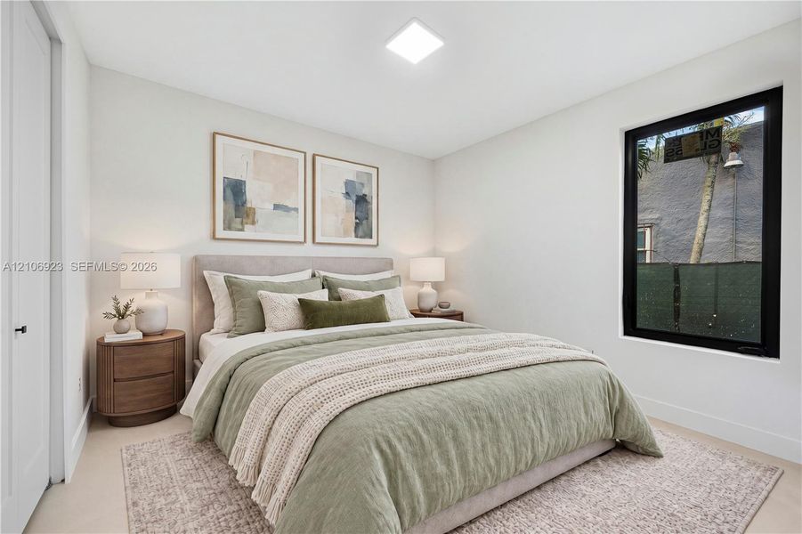 Neutral wall palette featuring high-contrast black window framing, clean-lined recessed lighting, and soft-toned wall-to-wall carpeting Neutral wall palette featuring high-contrast black window framing, clean-lined recessed lighting, and soft-toned wall-to-wall carpeting