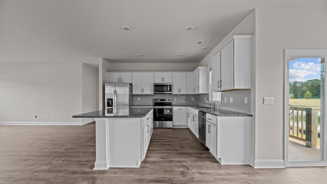 Furnished interior view inside a new home in Tyler - Home on the Lake, New Bern (Image 4). Furnished interior view inside a new home in Tyler - Home on the Lake, New Bern (Image 4).