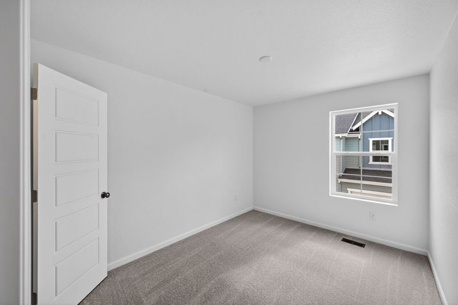 Spacious, unfurnished interior of a new home in Trailstone, Arvada (Image 7).