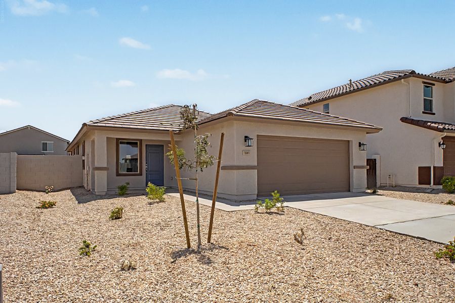 Front exterior of a new home in Wildera, San Tan Valley, AZ, highlighting curb appeal (Image 1). Front exterior of a new home in Wildera, San Tan Valley, AZ, highlighting curb appeal (Image 1).