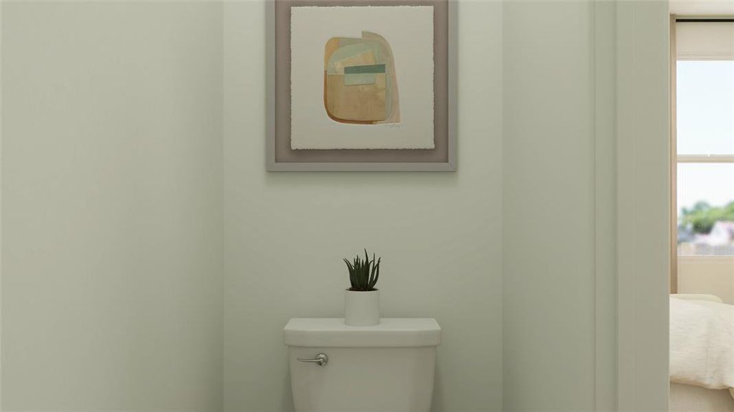 Bathroom with a healthy amount of sunlight and toilet