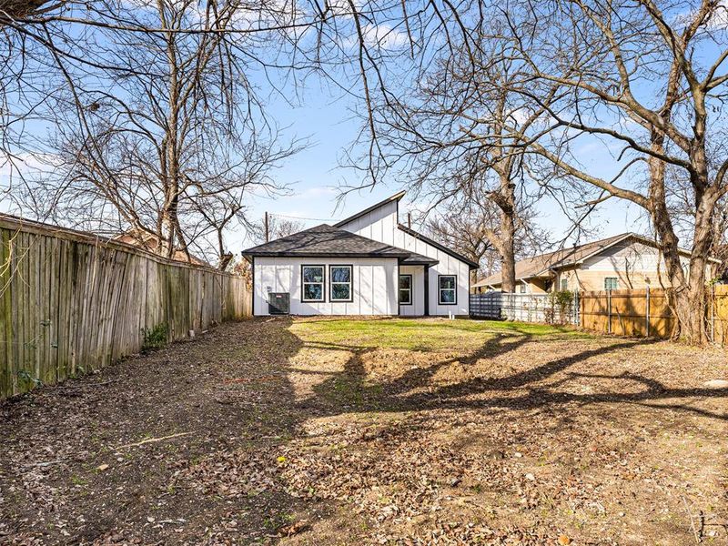 Back of house featuring central AC