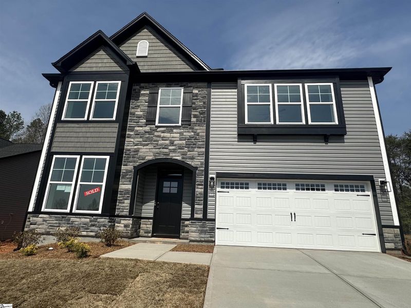 Front exterior of a new home in Shiloh Trail, Wellford, SC, highlighting curb appeal (Image 2).