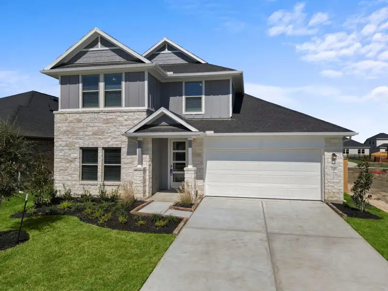 Front exterior of a new home in Laurel Landing, Alvin, TX, highlighting curb appeal (Image 2).