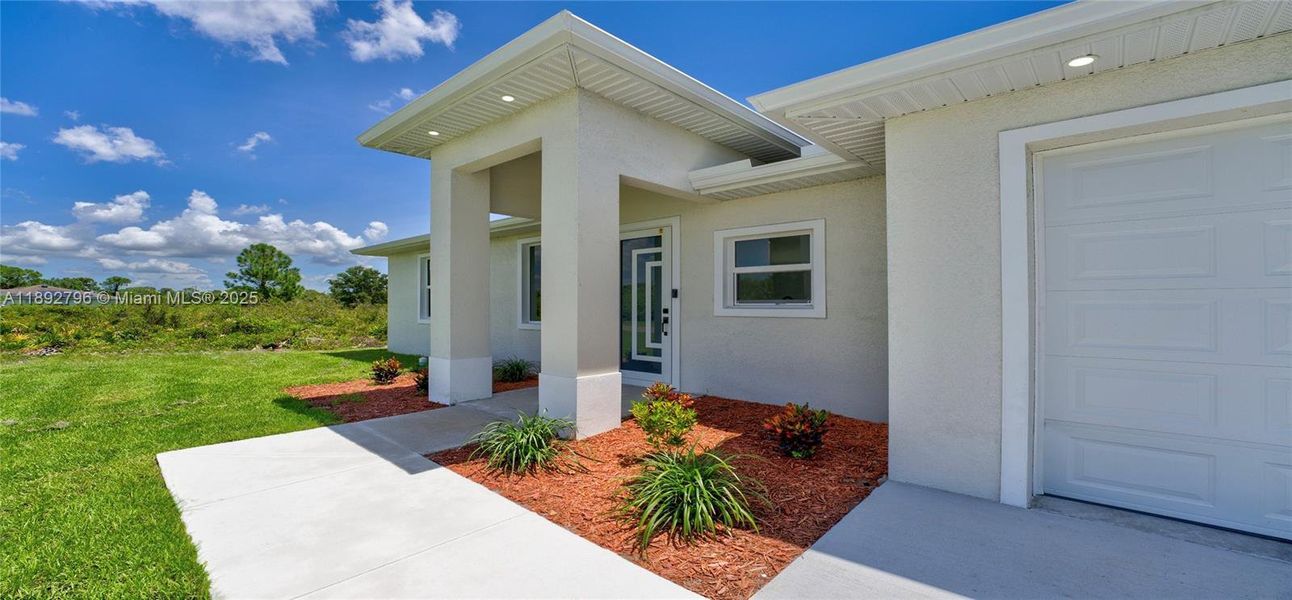Exterior details and patio area of a home in , Lehigh Acres (Image 2). Exterior details and patio area of a home in , Lehigh Acres (Image 2).