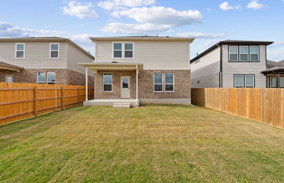 Exterior details and patio area of a home in Crosswinds, Kyle (Image 9).