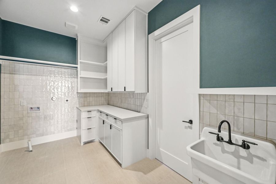 Tucked in the middle of the upstairs is the gorgeous utility room!