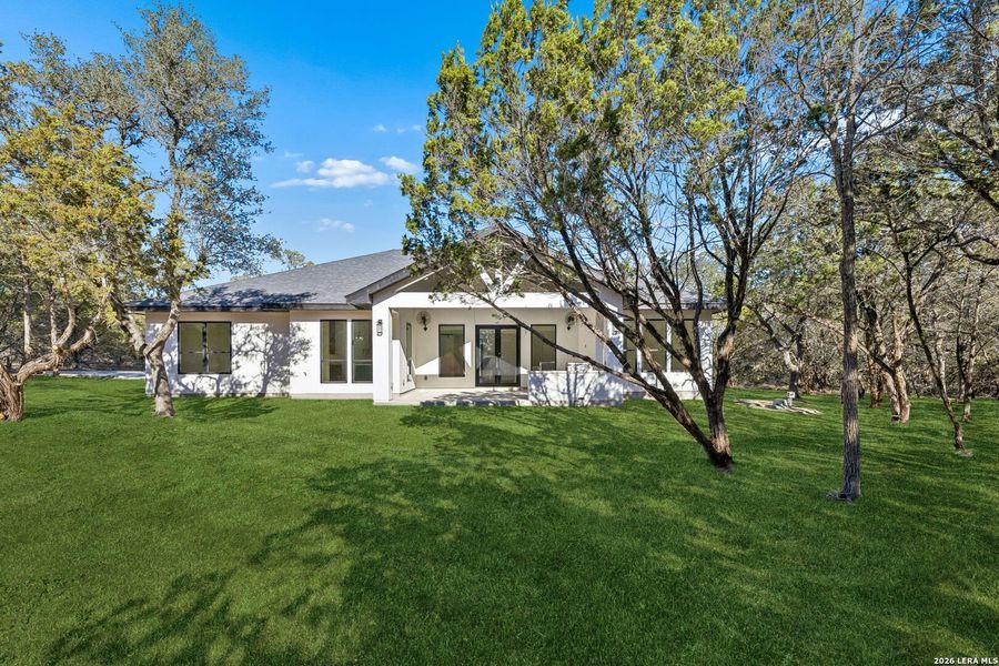 Exterior details and patio area of a home in , Spring Branch (Image 41).