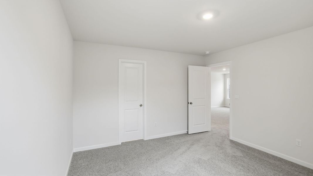 Spacious, unfurnished interior of a new home in Durbin Meadows Traditions, Fountain Inn (Image 28).