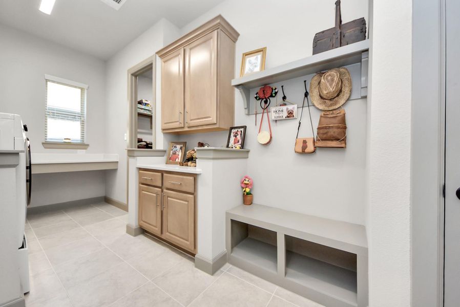 Go from laundry room straight into the large walk-in closet of the primary bedroom. Go from laundry room straight into the large walk-in closet of the primary bedroom.