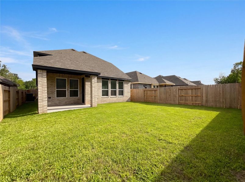 Exterior details and patio area of a home in Grand Central Park, Conroe (Image 2). Exterior details and patio area of a home in Grand Central Park, Conroe (Image 2).