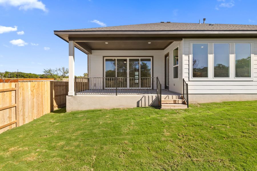 Exterior details and patio area of a home in Lariat, Liberty Hill (Image 27).