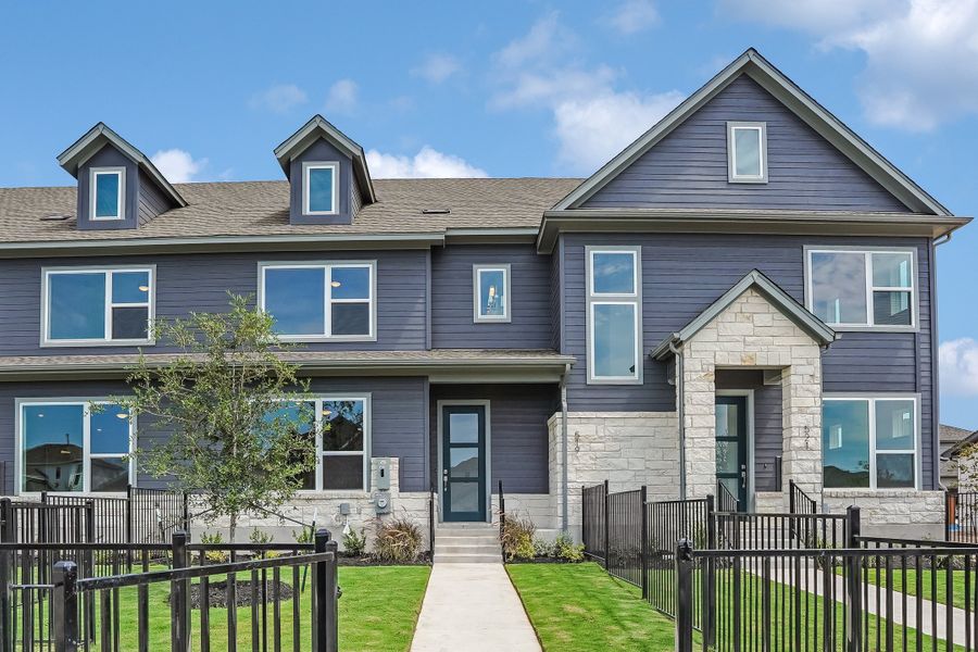 Front exterior of a new home in Emory Crossing, Hutto, TX, highlighting curb appeal (Image 24).