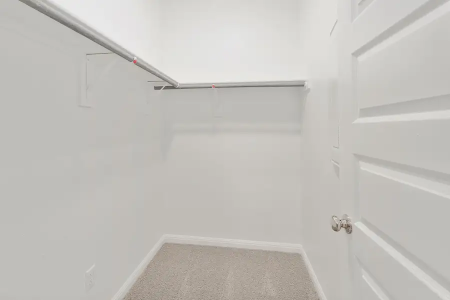 Primary Closet in the Ash home plan by Trophy Signature Homes – REPRESENTATIVE PHOTO