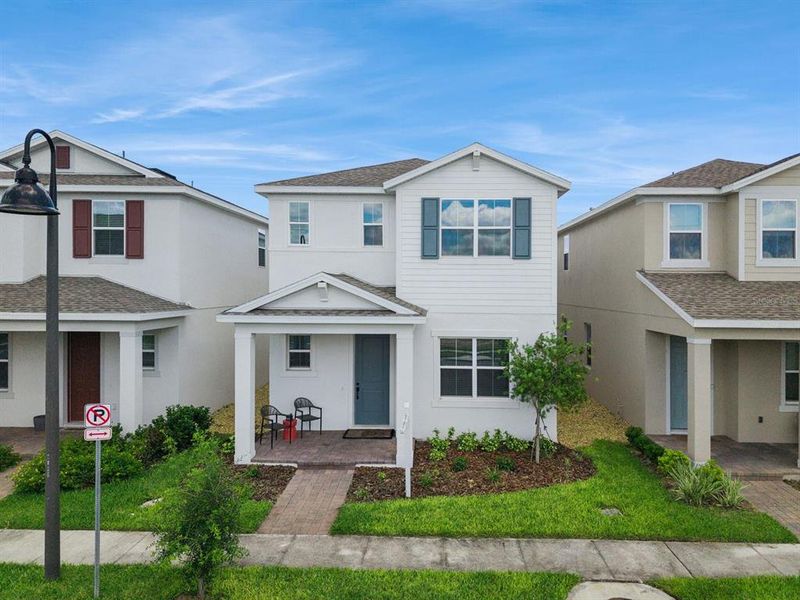 Front exterior of a new home in Osprey Ranch, Winter Garden, FL, highlighting curb appeal (Image 28).