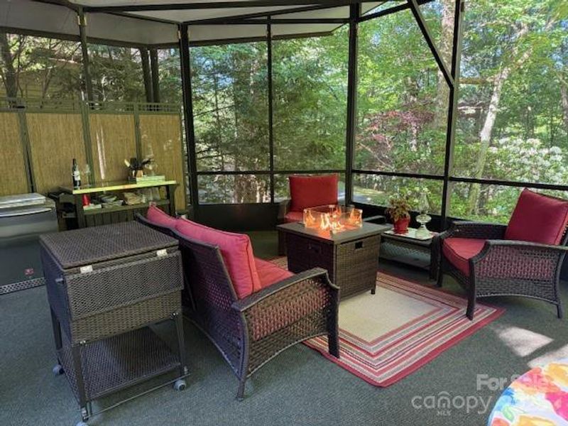 Screened porch 366 sq ft. with small refrigerator and ice cooler