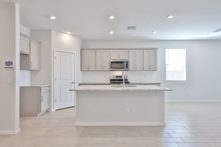 A kitchen with white cabinets. A kitchen with white cabinets.