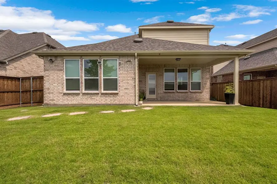 Exterior details and patio area of a home in , Little Elm (Image 3). Exterior details and patio area of a home in , Little Elm (Image 3).