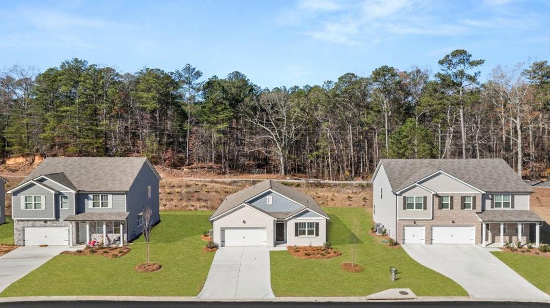 Front exterior of a new home in Northwoods at Mirror Lake, Villa Rica, GA, highlighting curb appeal (Image 19).