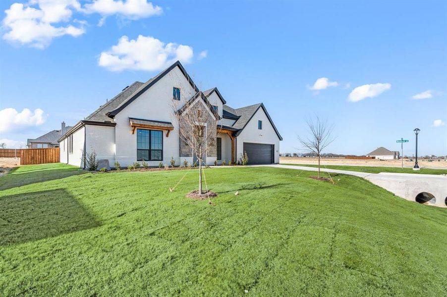 Front exterior of a new home in Settlers Glen, New Fairview, TX, highlighting curb appeal (Image 2). Front exterior of a new home in Settlers Glen, New Fairview, TX, highlighting curb appeal (Image 2).